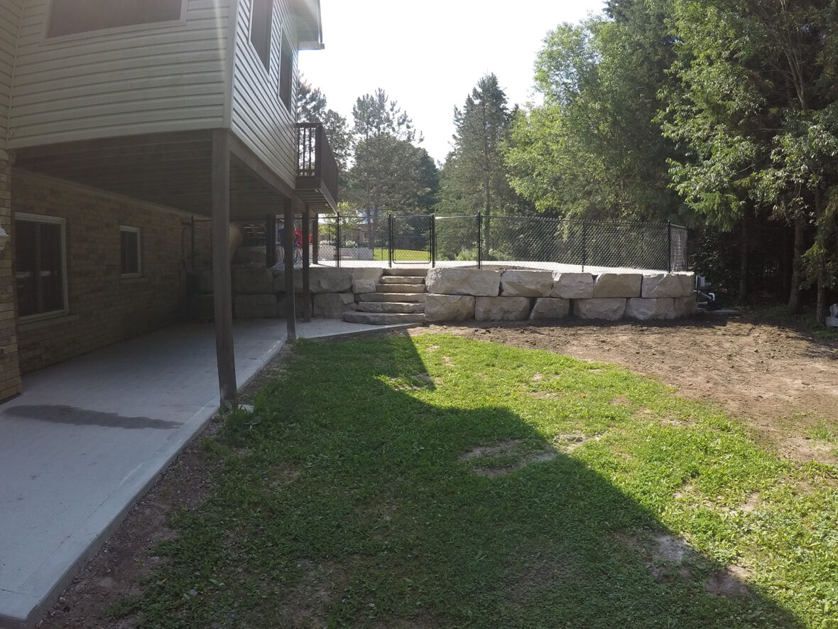 Armour Stone Retaining Wall, Steps, Chain Link Fence, Pool